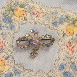 Vintage bow-shaped aurora borealis pin